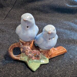 Ceramic bird-shaped salt and pepper shakers on a branch